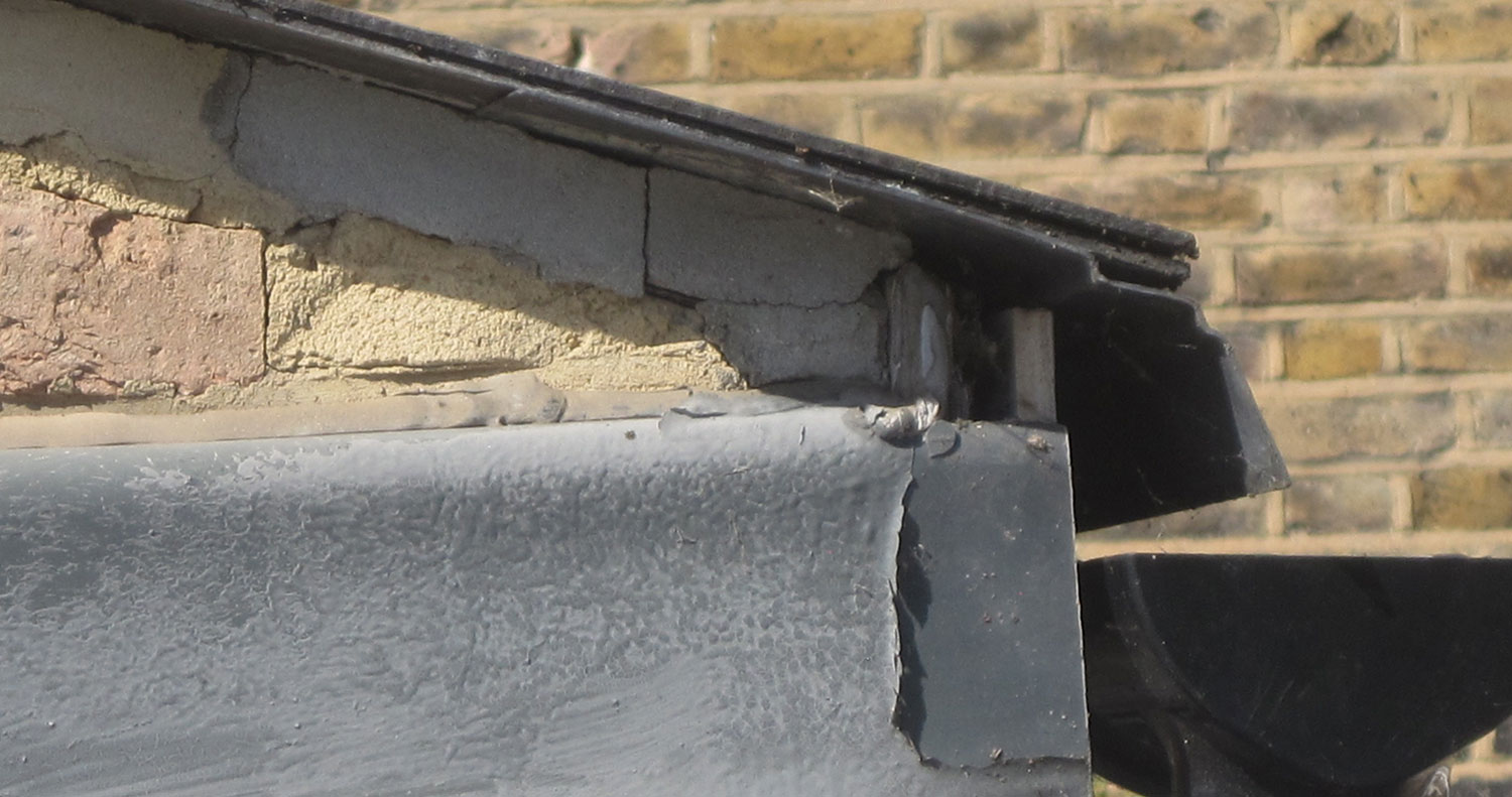 Roof junction detail illustrating why longer-term replacement should be anticipated.